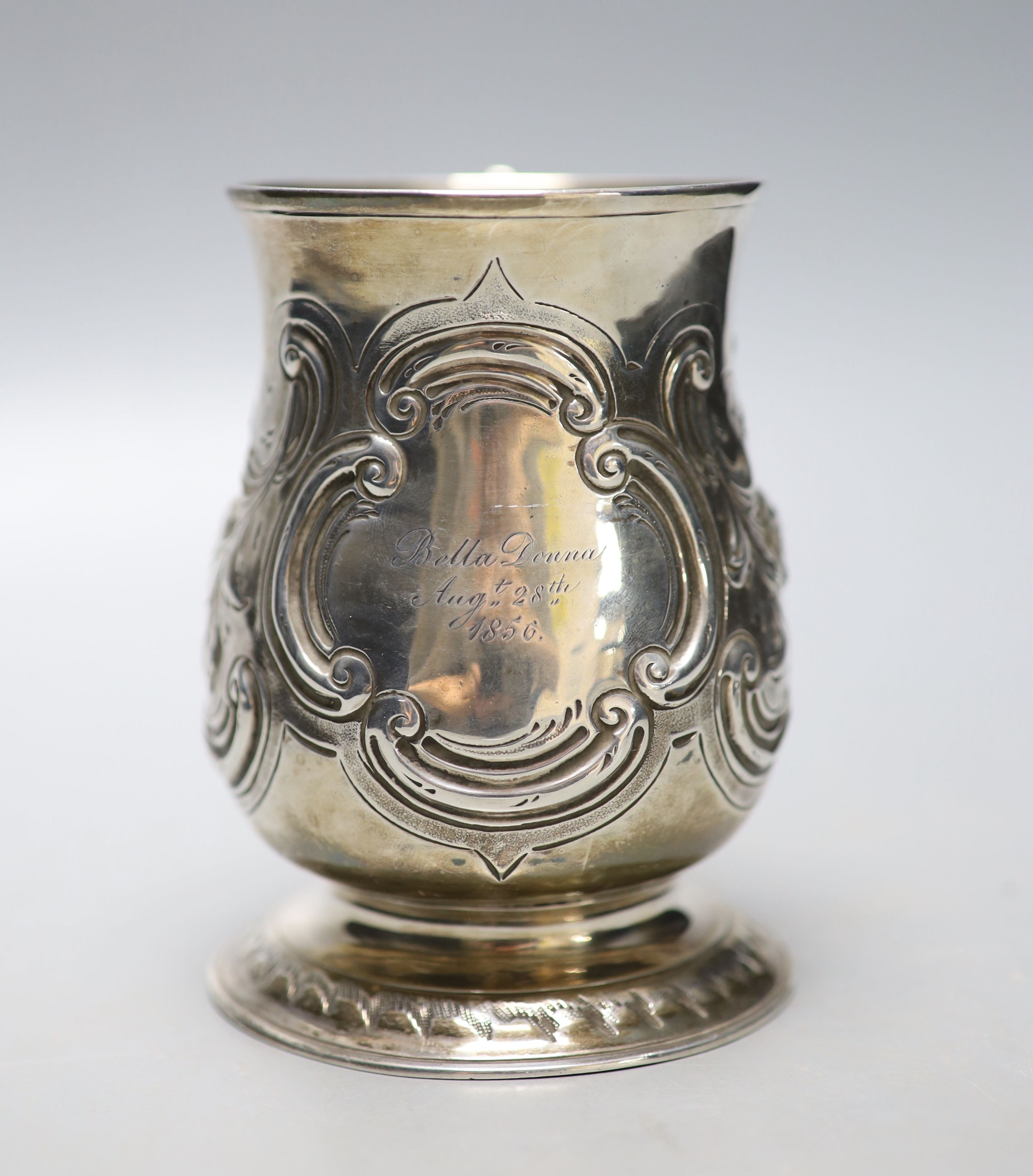 A George III silver baluster mug, with later embossed decoration and later engraved inscription, Langlands & Robertson, Newcastle, 1788, height 12.8cm, 11oz.